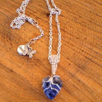 Sodalite Stone Wire Wrapped Pendant On Silver..