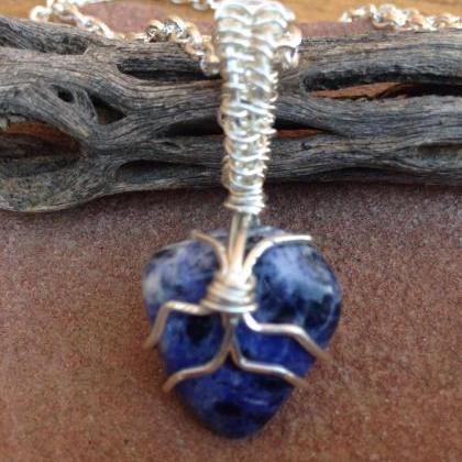 Sodalite Stone Wire Wrapped Pendant On Silver..